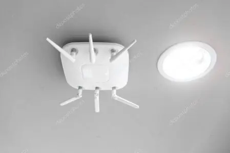Business office interior with ceiling-mounted access point