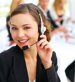 Friendly helpdesk agent assisting a client via headset