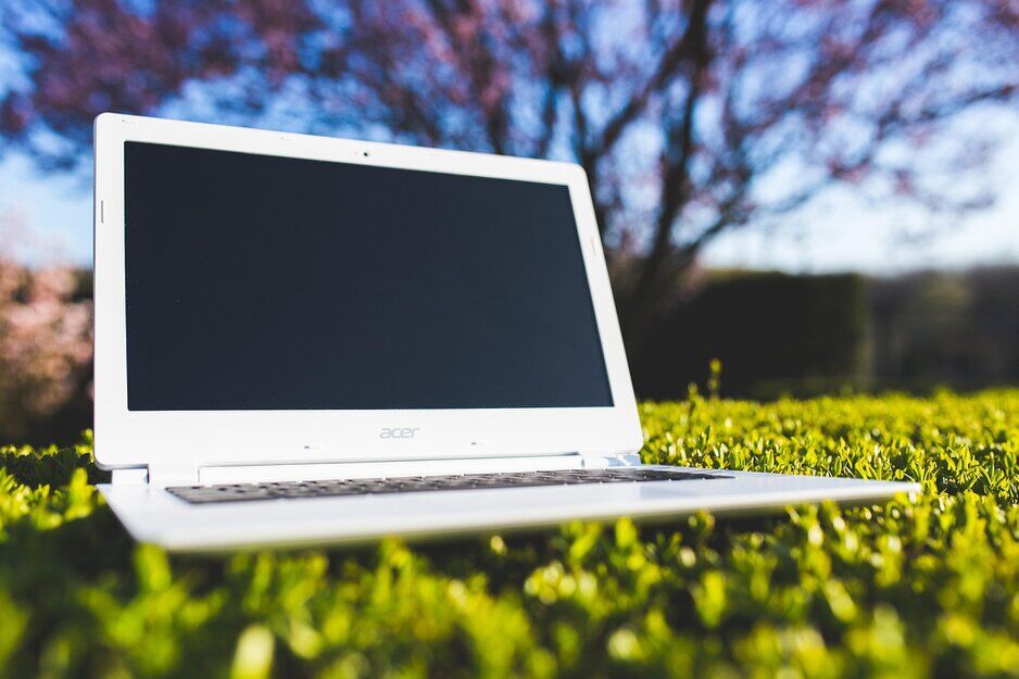 Technician preparing laptops with standard images